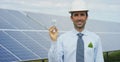 Technical expert in solar energy photovoltaic panels, remote control performs routine actions for system monitoring using clean, r Royalty Free Stock Photo