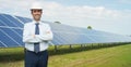 Technical expert in solar energy photovoltaic panels, remote control performs routine actions for system monitoring using clean, r Royalty Free Stock Photo