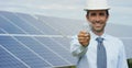 Technical expert in solar energy photovoltaic panels, remote control performs routine actions for system monitoring using clean, r Royalty Free Stock Photo