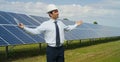 Technical expert in solar energy photovoltaic panels, remote control performs routine actions for system monitoring using clean, r Royalty Free Stock Photo