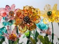 Technical flowers made of plastic and microchips on a light background