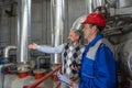 Technical Manager With Digital Tablet Standing Next to Worker in Power Plant Royalty Free Stock Photo