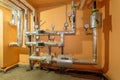 Technical pipes for sewerage in the basement of a building with pressure gauges. Sewerage system with electric drive