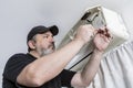 Technical professional in air conditioning finishing assembling the housing of an internal unit of a split air system Royalty Free Stock Photo
