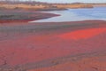 Technical settler of industrial water of mining industry with red soil polluted with iron ore waste in Kryvyi Rih, Ukraine Royalty Free Stock Photo