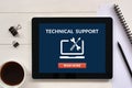 Technical support concept on tablet screen with office objects Royalty Free Stock Photo