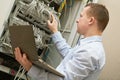 Support network service engineer with server computer equipment