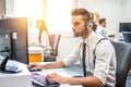 Technical support operator working on computer in call center. Royalty Free Stock Photo