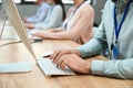 Technical support operator working at table in office, closeup