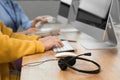 Technical support operators working at table in office