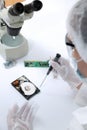 Technical surgeon working on hard drive - data recovery Royalty Free Stock Photo