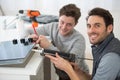 technician and apprentice using silicon gun Royalty Free Stock Photo