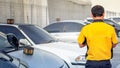 Technician Attends to Customer`s Vehicles at an Auto Repair Service Center Royalty Free Stock Photo