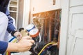 Technician checking air conditioner Royalty Free Stock Photo