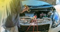 Technician checking air conditioner in engine room of eco car , cleaning air conditioner of car Royalty Free Stock Photo