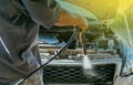 Technician checking air conditioner in engine room of eco car , cleaning air conditioner of car Royalty Free Stock Photo