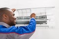 Technician Checking Air Conditioner Royalty Free Stock Photo