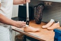 Technician checking artificial limb while at desk in workshop, adjusting it and checking for quality Royalty Free Stock Photo