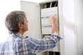 Technician checking on electric box at home
