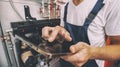 The technician checking the heating system in the boiler room with tablet Royalty Free Stock Photo