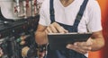 The technician checking the heating system in the boiler room with tablet Royalty Free Stock Photo