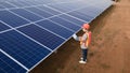 Technician checking the panel in solar power station panels Royalty Free Stock Photo