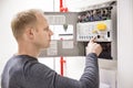 Technician checks fire panel in data center