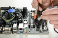 A technician checks the serviceability of the motherboard