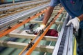 The technician cleaning conveyor belt in production line at factory plant Royalty Free Stock Photo