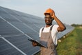 Technician with clipboard doing inspection of solar panels Royalty Free Stock Photo