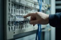 Technician configuring server components inside a data center rack cabinet Royalty Free Stock Photo