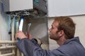 Technician controlling the heating system