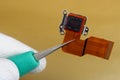 A technician controls the quality of a modern sensor for a photo camera