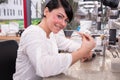 Technician at work in a dental lab or workshop producing a prostheis Royalty Free Stock Photo