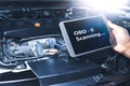 Technician diagnostics of code failure with OBD2 scanner technology on tablet Royalty Free Stock Photo