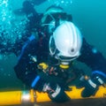 Technician diver repairing leaking nord stream gas pipeline underwater imaginary illustration leaking gas Royalty Free Stock Photo