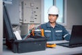 Technician is download data from the Solar panel performance check tool to analyze on a computer so that the power generation can Royalty Free Stock Photo