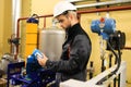 Technician engineer cheking probes pressure sensors on industrial power refinery plant