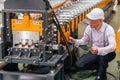 Technician engineer male machine service worker, professional work checking machine in plant factory Royalty Free Stock Photo