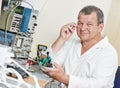 Technician engineer at work with microchip Royalty Free Stock Photo