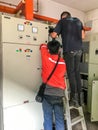 Technician and engineer working on maintenance at Main switchboard MSB room