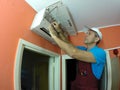 Technician Remove And Clean The Filter Of Air Conditione Royalty Free Stock Photo