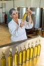 Technician examining olive oil