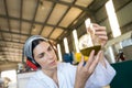 Technician examining olive oil produced from machine