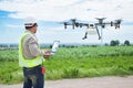 Technician farmer use wifi computer control agriculture drone