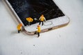Technician figurine model repair mobile display screen crack broken