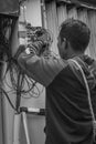 A technician fix the phone wiring outside the property