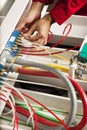 Technician fixing cabling and wiring circuit