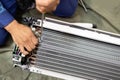 Technician is fixing or checking the evaporator system, troubleshooting air conditioning unit or dismantling for air conditioner