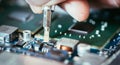 Technician is fixing a computer circuit board, hand and screwdriver Royalty Free Stock Photo